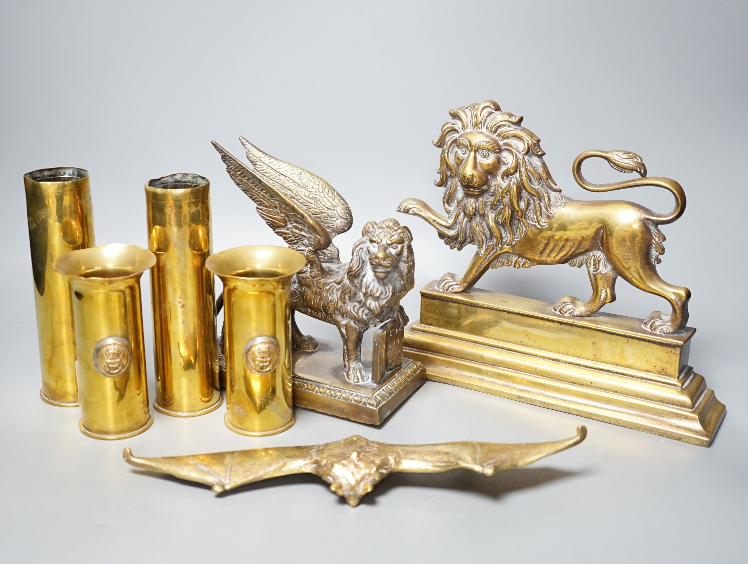 A brass ‘bat’ pin tray, two lion figures and sundry metalware, lion door stop 20 cms height x 25 cms width